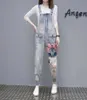 Kvinnors jumpsuits rompers kvinnor trycker tecknad denim jumpsuit overaller hål lösa pärlstav jean pants kvinna plus size casual 222r