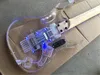 Vänsterhänt blått LED-ljus Akrylkropp Electric Guitar med Tremolo Bridge Rosewood Fingerboard kan anpassas