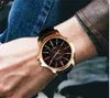 Оптовики купить массовые Wat8103 Модные мужские кварцевые часы формальные деловые круглые сплавные кожа кожа мужские наручные часы.