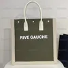 حقيبة Rive Gauche في قماش مخطط من الجلد القش الكبير حقائب اليد الشاطئية للسيدات Luxurys المصممين أعلى مقبض أكياس التسوق قماش