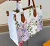 Kvinnors designer Totes shoppingväskor dam hög kapacitet handväskor blommor bokstav tryck på läder axel kors kropp plånbok handväska original kvalitet