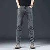 Jeans spessi invernali da uomo autunnali Pantaloni dritti sottili elastici per giovani di marca di moda da uomo