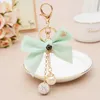 Nyckelringar Elegant band Bow-Knot Crystal Ball Crown Keychain for Women Girl Cute Pompom Fur Key Chain Bags Charms Keyring Party Gift Enek22