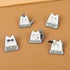 Cute white cat gets hit by an arrow, plays handsome brooch with a knife, clothing accessories, metal badges and funny buttons