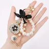 Keychains Bow-Knot Imitation Pearl Parfym Crystal Bottle Iron Tower Chain Keychain Car Key Ring Bag Charm Accessories Girl Keyring Gift