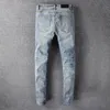 سروال زرقاء زرقاء جينز رفيع النحافة ممزق راكب الدراجة النارية Moto Hip Hop Street Fashion for Young Mens Stretch Plant Patch Straight Denim Long Strendy Zipper