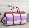 Designers moda 55cm Duffel sacos de luxo homens femininos sacos de viagem de couro bolsas de couro grande capacidade de espera de bagagem