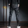 Pantaloni casual da uomo Streetwear coreano Pantaloni slim fit elasticizzati neri 220330