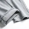 Herr jeans män grå denim casual knappar hål rippade nödställda byxor raka byxor