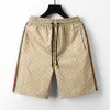 Pantalones cortos para hombres estilo europeo summer running sports play beach marca de diseñador de panal estirado algodón estirado y suelto de sudo seco y seco con cintura elástica