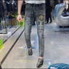 Jeans da uomo testa di tigre ricamata primavera 2022 nuova moda slim fit distintivo stampato piccoli pantaloni dritti streetwear pantaloni in denim