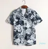 2022 nya säsongen Herr Kvinnor Fritidsskjortor Sommar Hawaii Style Knappslag Kofta Kortärmad Oversized skjorta Blusar toppar märkesdesigner