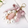 Kreki Trend Tassel Bierek dla kobiet Dziewczyny Masowe torby samochodowe Kluczowe pierścienie Spring Pink Bow Pearl Round wisiorek