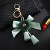 Keychains Number 5 Camellia Bag Pendant For Woman Luxury Jewelry Bow Car Keyring Bowknot Pearl DecorationKeychains Emel22