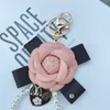 Women Designer Keychains Bow Camellia Imitation Pearl Key Rings Chain PU Leather Rose Flower 5 Bag Pendant Accessories Fashion Heart Charms Jewelry Keyring Holder