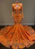 Długi rękaw Wysokiej szyi Arabski Prom Dresses 2022 Sexy Mermaid Style Orange Cekiny Aplikacja Afryki BlaCl Girls Evening Gala Suknie