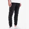 Herr jeans män vår höst män bomull denim hip hop slack botten jogger streetwear mager blå byxor elastisk midja hombre hane