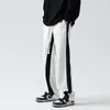 Pantaloni da uomo 2023 Pantaloni larghi con giunture a righe Stampa Casual Hip Hop Pantaloni di tendenza moda Pantaloni elastici in vita Pantaloni sportivi M-2XL