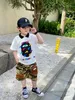 Pantalones cortos de camuflaje a la moda para niños, pantalones cortos medio sueltos con bolsillo estéreo para niños, ropa informal de verano 2022 Q65881935879