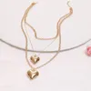 Catene Elegante collana con ciondolo a forma di cuore per le donne Collana in oro lucido multistrato con catena a cerchio con cuori