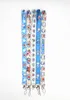 Fabrikspris 100 stycken Doraemon Anime Lanyard Nyckelring Halsrem Nyckel Kamera ID Telefonsträng Hänge Märke Fest Presenttillbehör Partihandel