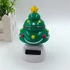 Kerstdecoraties thema zonne -aangedreven dansen Santa Claus Swingende bobble nieuwigheid speelgoed auto decor speelgoed kinderen cadeau c0915