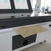 Tagliatrice del laser di Co2 del panno del tessuto dell'indumento del tappeto del tessuto delle quattro teste 1600*1000mm 1610 130w 150w 180w