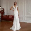 Abiti da sposa eleganti con applicazioni in pizzo Abiti da sposa con strascico staccabile Bottoni con scollo a V senza maniche su misura Vestido de novia