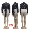 Modebrevtryck Bandage Blusar för kvinnors långärmad Cardigan-knapp V-Neck Casual Brand Crop Shirts J2432