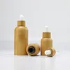 エッセンシャルオイルの目の滴の香水エレガントな化粧品の容器のための10mlの天然竹の琥珀色のガラスの滴のびん