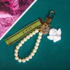 Trendy Schlüsselbund Luxus -Designerschlüsselanhänger Key Buckle Classic Letter Stoff Perlen Kette 4 Stile Hochwertige Schlüsselanhänger Bag Orn8790093