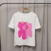 女性用Tシャツの春と夏のニッチオールマッチブロンズサンフラワープリントホワイトファッショントップ女性の短袖のTシャツ人