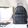 Designer de luxe 7A qualité mode sac d'école été en cuir véritable épaule fourre-tout sac à main sacs femmes hommes sac à dos Sport extérieur MC voyage sacs à dos d'embrayage