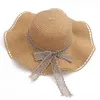 Chapeau de paille de plage d'été dames grand bord pliable arc chapeau de plage 2022 nouvelle femme vacances d'été Panama fille chapeau de soleil en gros G220301