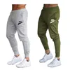 Gymtr￤ning jogging byxor joggar m￤n dragstring tr￶jor sportbyxor mode h￶ft pop sp￥rpants avslappnade bottnar varum￤rke logotyp