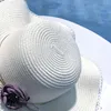 Chapeaux à large bord 2022 européen et américain printemps été bord de mer parasol fleurs grands avant-toit plage dames chapeau de paille respirant