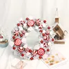 装飾的な花の花輪玄関の窓飾り屋内冬の休日の装飾のためのキャンディーガーランド付き人工クリスマス花輪