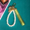 Trendy KeyChain Luxury Designer Keys Pendant Key Buckle Classic Letter Fabric Pearls Chain 4 Styles Högkvalitativa nyckelringar Bag Orn4910815