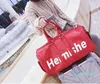 Высококачественная кожаная кожаная мода Мужчины Man Travel Bag Women Duffle Bag 2022