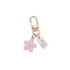 Keychains Korea Ins Metal Daisy Keychain Niche Flower Accessories Pendant Key Chain Cute Charms Llaveros Emel22