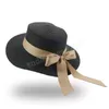 Raffia halm strand hatt för kvinnor skugga hatt med bowknot vår sommar platt breda grim hattar kvinna solskydd mössa flickor kepsar kvinnliga sunhat lady sunhats grossist
