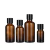 Imballaggio Vuoto Bottiglia marrone trasparente Spalla tonda Coperchio a vite nero con tappo interno Contenitore per imballaggio cosmetico ricaricabile portatile 5ML 10ML 15ML 20ML 30ML 50ML 100ML