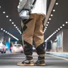 Houzhou мужские грузовые брюки для мужчин Harajuku брюки мужские свободные корейские уличные одежды хип-хоп японский 5XL карманный сращенный 220325