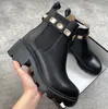 Luxury Designers Ankle Martin Boot Black Leather Boots Rubber Sole Low Heel Waterproof Belt Buckle Textured Leather Trim Women Men Wellies