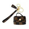 Plaid cuir porte-clés anneau bijoux marron gland sans fil Bluetooth casque étui voiture porte-clés titulaire mode porte-clés accessoires mignon