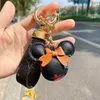 Chaves de flores criativas e velhas Fashion Correia de couro Chain de animais e presentes de feminino para feminino Mão de pingente de carros pendentes pequenos presentes