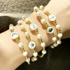 Braccialetti con ciondoli FLOLA Perle d'oro Smalto di perle Luna e stella Per le donne Bracciale con perline incrociate fatte a mano Gioielli all'ingrosso Brtd26 Kent22