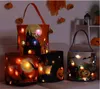 Halloween Glow Basket Pumpkin Bag med ljus 9.4x9.4 tum barn hanterar godispåsar Ghost Festival Portable Bucket Decoration Props Present Wrap By Air A12