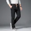 Varumärke harem jeans män höst mitt i rak denim byxor mode casual fast färg elastisk midja mens lösa jeans cx220401