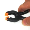 Set di utensili manuali professionali 10 pezzi / lotto 2 pollici Clip universali in plastica Morsetto Strumenti di fissaggio per dispositivi di fissaggio per tablet per telefoni cellulari Schermo LCD incollato R